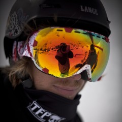 Potrait of a rider wearing an Out Of Eyes ski goggle under his wipeout helmet