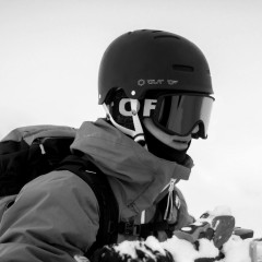 A rider wearing an Out Of Shift ski goggle under his wipeout helmet